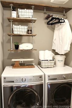 a washer and dryer sitting next to each other in a room with shelving