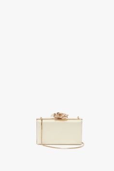 Meticulously hand-crafted by artisan makers, this delicate Minaudiere in Chamomile is a unique piece in the Victoria Beckham accessories edit. With a bespoke brass frame, sumptuous satin body and exquisite flower clasp, it has a precious jewel-like appearance. The squared link chain shoulder strap is detachable for versatility and the nude-lined interior will keep personal items safe. Victoria Beckham Frame Flower Minaudiere in Chamomile  - Size ONE SIZE UK Feminine Gold Rectangular Clutch, Gold Rectangular Case Bag With Gold-tone Hardware, Elegant Yellow Gold Bags With Gold-tone Hardware, Luxury Gold Rectangular Case Bag, Feminine Gold Evening Bag For Wedding, Chic Yellow Gold Rectangular Bag, Gold Feminine Evening Bag For Formal Occasions, Luxury Rectangular Clutch With Gold-tone Hardware, Feminine Rectangular Evening Clutch