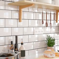 the kitchen counter is clean and ready to be used for cooking, with utensils hanging on the wall