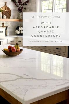 a marble counter top in a kitchen with text overlay that reads get the look of marble with afordable countertops