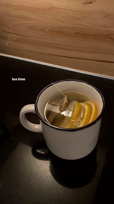 a cup filled with liquid sitting on top of a counter