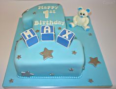 a birthday cake with blue frosting and stars