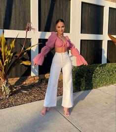 33 Chic Spring Outfits to Refresh Your Wardrobe in 2024 - Elegance Echoes White Jeans And Pink Top Outfit, Wide Leg Pants Outfit White, Pink Top And White Jeans Outfit, White Bell Bottoms Outfit Summer, White Pants Party Outfit, Barbie Pants Outfit, How To Style Pink Crop Top, Pink Shirt With White Pants, White Jeans Pink Top Outfit