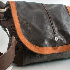 Upgrade Your Everyday Carry With This Vintage Cole Haan Messenger Bag, Crafted From Genuine Leather And Designed With Practical Features That Cater To Your Versatile Needs. The Sleek, Stylish Appearance Makes It Suitable For Various Occasions, From Office Meetings To Weekend Adventures. This Thoughtfully Designed Bag Boasts A Magnetic Closure For Easy Access, Side Accessory Pockets To Keep Your Essentials Organized, An Inside Zipper Pocket For Added Security, And A Canvas-Lined Interior For Durability. The Padded, Adjustable Shoulder Strap Ensures Comfort While Carrying, Making It A Perfect Companion For On-The-Go Individuals. With Ample Storage Options And A Timeless Aesthetic, This Cole Work Essentials, Messenger Bag Men, Designer Bag, Distressed Leather, Everyday Carry, Vintage Wear, Week End, Cole Haan, Zipper Pocket