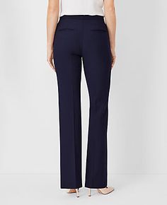 Elevate your wardrobe with the Ann Taylor High Rise Trouser Pant in Seasonless Stretch, a perfect blend of style and comfort. These trousers are designed to flatter with a high-rise waist that sits just below the natural waistline, and a tailored fit that streamlines your silhouette. The slight flare at the leg opening adds a touch of elegance, making these pants ideal for both office and evening wear.

- **Size:** Regular - 4
- **Color:** Deep Navy Sky
- **Material:** 68% Polyester, 29% Viscose Four-way Stretch Office Trousers, 4-way Stretch Office Trousers, 4-way Stretch Trousers For Office, Fitted Versatile Pants With Welt Pockets, Versatile Fitted Pants With Welt Pockets, Tailored Versatile Formal Dress Pants, Versatile 4-way Stretch Office Pants, Versatile 4-way Stretch Pants For Office, 4-way Stretch Tapered Leg Office Pants