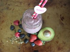 a smoothie with strawberries, kiwi and berries