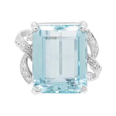 This wonderful 18 carat white gold dress ring features an emerald cut aquamarine weighing approximately 13.00 carats, mounted in a four claw, open back setting. The impressive stone is accompanied by two white gold ribbons on either side, each inlaid with 7 eight cut diamonds, weighing approximately 0.20ct in total. Stamped 750. UK finger size 'O'. Luxury White Topaz Jewelry, Elegant Octagon Aquamarine Ring, Elegant White Gold Octagon Topaz Ring, Elegant Gia-certified Topaz Ring With Emerald Cut, Elegant Gia Certified Topaz Ring Emerald Cut, Formal Square Cut Topaz Ring With Prong Setting, Formal Asscher Cut White Gold Topaz Ring, Formal Emerald Cut Aquamarine Diamond Ring, Formal Emerald-cut Aquamarine Diamond Ring