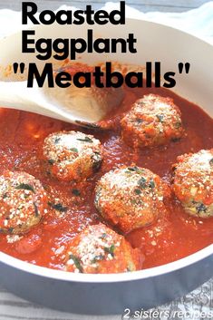 meatballs in tomato sauce with parmesan cheese on top and text reading roasted eggplant meatballs