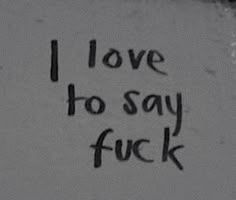 graffiti written on the side of a building that says i love to say f k