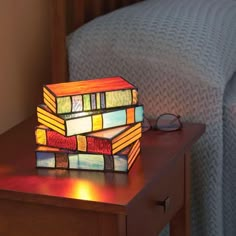 a lamp sitting on top of a wooden table