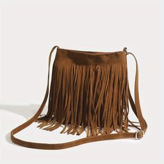 Discover the Ultimate Bohemian Accessory Introducing the perfect blend of style and functionality—our Vintage Suede Fringe Crossbody Bag. This exquisite shoulder bag embodies the essence of bohemian chic, elevating any outfit with its sophisticated flair and playful tassels. Designed for the modern woman who cherishes both elegance and convenience, this bag is a must-have accessory that complements every occasion, from the laid-back to the lavish. Key Features Charming Bohemian Style: Elevate your wardrobe with the bag’s elegant boho aesthetics. Trendy Tassel Decoration: Add a playful touch to your ensemble with chic, eye-catching tassels. Soft and Durable Material: Crafted from premium PU leather, offering both comfort and durability for daily use. Adjustable Shoulder Strap: Custom-fit to Boho Crossbody Bag, Tassel Purse, Fringe Crossbody Bag, Bohemian Accessories, Fringe Bags, Vintage Suede, Design Del Prodotto, Tassel Bag, Styl Boho