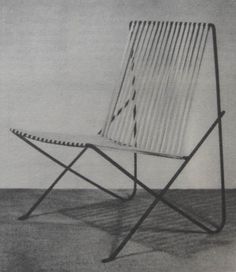 an old black and white photo of a folding chair