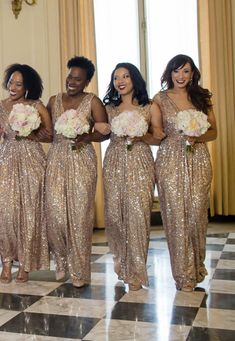 the bridesmaids are all dressed in gold sequins and holding bouquets