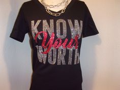 You are viewing a v neck fitted shirt with Know yours Worth in rhinestone and glitter vinyl material. Material Cotton and 5% spandex Style V neck fitted Color Black See the measurement below are across the chest areas and the shirt sizes. small - 15' (0-6) medium - 16" (6-8) Large - 17"( 8-10) XL - 18" (12-14) 1x - 21 (14-16) 2x - 23"(18-20) 3x' 26"(22-24) Fitted Black T-shirt With Rhinestones, Fitted Rhinestone T-shirt For Party, Fitted Bling Tops For Night Out, Bedazzled Fitted Top For Night Out, Black V-neck Tops With Rhinestones, Black V-neck Top With Rhinestones, Fitted Short Sleeve Tops With Glitter Print, Embellished Stretch V-neck Tops, Stretch Embellished V-neck Tops