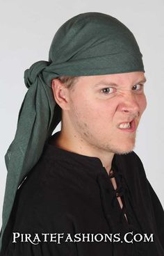 a man wearing a green bandana and making a funny face