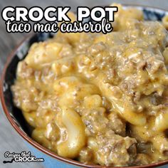 crock pot taco mac casserole in a blue and brown bowl on a wooden table