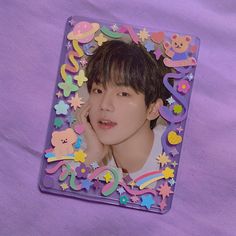 an image of a young man that is in a plastic frame with stars and bears on it