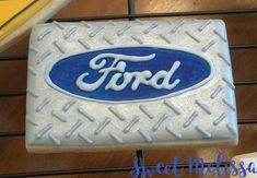 a close up of a cake with the word ford on it