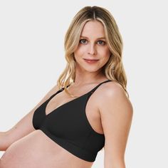 A plunge bra that gives you the look without the wire. The V-Neck Maternity & Nursing Bra is sustainably made with a single layer of stretchy recycled nylon for gentle support in a soft and lightweight style. Beautifully detailed with a low v-neckline and crossover band that embraces a pregnant belly. It's an uncomplicated design with an intuitive fit for the many adventures with baby to come. Fitted V-neck Nursing Bra With Built-in Bra, Fitted Black Nursing Bra With Seamless Construction, Fitted Seamless Nursing Bra With V-neck, Stretch V-neck Nursing Bra, Seamless Stretch V-neck Nursing Bra, Stretch V-neck Nursing Bra With Medium Bust Support, Black Nursing Bra With Full Coverage And Light Support, Stretch Nursing Bra With Medium Bust Support, V-neck, Fitted V-neck Nursing Bra With Removable Pads