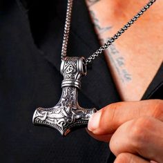 Tap Into The Timeless Power Of Viking Mythology With Our Viking Celtic Anchor Hammer Thor Pendant Necklace. Crafted With Meticulous Attention To Detail, This Necklace Is A Striking Symbol Of Strength And Heritage. The Pendant Features An Antique Silver Viking Thor Norse Amulet, Evoking The Valor And Spirit Of Ancient Warriors. Made From Durable Stainless Steel With A Silver Finish, It Boasts An Antique Look That Adds Depth And Character. Included With The Pendant Is A 24-Inch Chain, Providing A Engraved Gunmetal Jewelry As Gift, Engraved Gunmetal Jewelry For Gifts, Gunmetal Jewelry With Adjustable Chain For Gift, Gunmetal Necklace With Silver Chain As A Gift, Gunmetal Necklace With Silver Chain For Gift, Gunmetal Box Chain Jewelry As Gift, Engraved Gunmetal Necklace For Gift, Black Stainless Steel Jewelry For Jewelry Making, Viking Thor