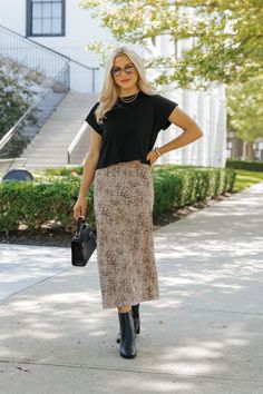 Add a touch of wild flair to your wardrobe with the Brown Leopard Print Midi Skirt! This effortlessly stylish piece combines bold print with a flattering fit, making it perfect for any boho-chic look. Designed with a lightweight fabric, this skirt offers comfort and flow, making it ideal for all-day wear. Pair this skirt with a simple tank, graphic tee, or your favorite cozy sweater for a versatile style that transitions seamlessly from day to night. Trendy Leopard Print Lined Skirt, Chic Lined Leopard Print Skirt, Leopard Print Midi Skirt, Leopard Print Fitted Midi Skirt, Flowy Lined Leopard Print Skirt, Leopard Print Relaxed Midi Skirt, Sorority Rush Outfits, Cheetah Skirt, Rush Outfits