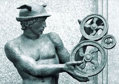 the statue is holding a circular object in his hands