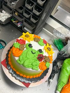 a decorated cake sitting on top of a counter