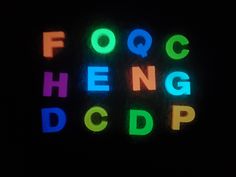 the word fooc heng dop is lit up in neon colors on a black background