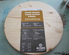 a wooden table with a sign on it that says stain grade edge glued panel