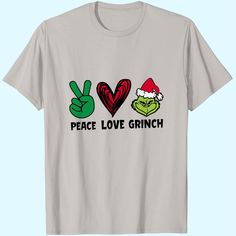 a white t - shirt with peace love grin on the front and two fingers in the middle