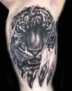 a black and white tattoo of a tiger