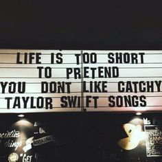 a sign that says life is too short to pretend you don't like catchy taylor swift songs