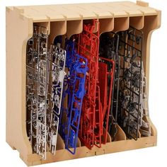 a wooden box filled with lots of different types of metal parts in it's compartments