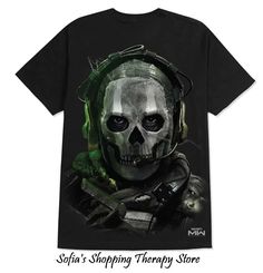 a t - shirt with a skull wearing headphones and a helmet on it's face