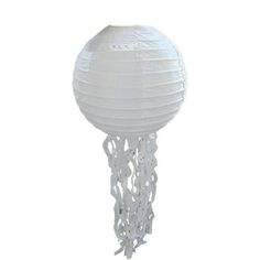 a white paper lantern hanging from the ceiling