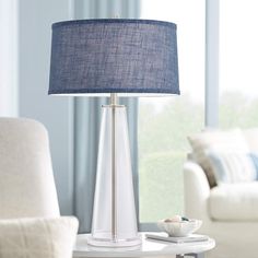 a table lamp with a blue shade on it