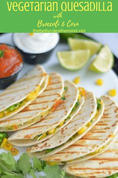 a plate filled with quesadillas and garnished with cilantro