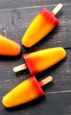 four popsicles that are sitting on a table