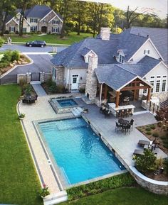 an aerial view of a house with a swimming pool