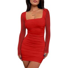 a woman wearing a red dress with long sleeves and cutouts on the chest,