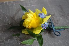 a yellow flower with blue flowers on it