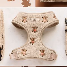 the dog harness has teddy bears on it's front and back sides, along with other accessories