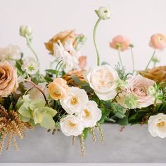 a bunch of flowers that are sitting in a vase