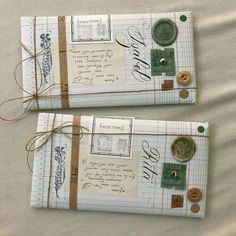 two pieces of paper with buttons and writing on them are wrapped in brown twine