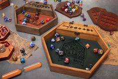 several wooden boxes with dices and other items on the floor next to each other