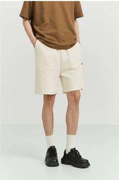 Make a statement with our Textured Jogger Shorts, designed for both comfort and style.
Crafted with a blend of 88.2% cotton and 11.8% polyester, these jogger shorts offer a relaxed fit with an elastic waist, perfect for the modern man. The textured fabric and patch pocket detail provide a touch of sophistication that distinguishes these shorts from your everyday casual wear.
Versatile enough for a day out or a laid-back evening, pair these shorts with a simple tee for casual outings or elevate y Beige Leisure Shorts For Summer, Leisure Short Pants With Drawstring, Leisure Drawstring Short Pants, Casual Drawstring Shorts For Streetwear, Comfortable Relaxed Fit Summer Bottoms, Casual Drawstring Short Pants, Cotton Bermuda Shorts With Built-in Shorts, Sporty Cotton Pants With Built-in Shorts, Casual Bermuda Shorts For Spring