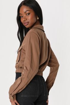 Functional yet fashionable is what the Lulus Eldora Brown Cropped Utility Jacket is all about! Lightweight, woven twill shapes this versatile jacket with a collared neckline and long sleeves with button cuffs. The relaxed bodice features two patch pockets, a full button placket, and an elasticized, cropped hem with adjustable drawstring pulls. Fit: This garment fits true to size. Length: Above mid-thigh. Size medium measures 20" from shoulder to hem. Bust: Great for any cup size. Waist: Fitted - Chic Single Breasted Top With Lapel Collar, Chic Single-breasted Top With Lapel Collar, Chic Collared Utility Jacket With Flap Pockets, Trendy Tops With Lapel Collar For Work, Fall Button-up Tops With Hidden Button Closure, Fitted Cropped Jacket With Flap Pockets And Long Sleeves, Fitted Cropped Jacket With Flap Pockets, Fitted Cropped Jacket With Flap Pockets And Collar, Fitted Collared Cropped Jacket With Flap Pockets