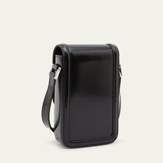 Saint Laurent "Solferino" mini crossbody phone bag in smooth calfskin leather Adjustable leather shoulder strap; approx. 17-22"L Can be styled on the shoulder or crossbody Flap top Pivoting Cassandre closure Interior, two card slots Leather lining Approx. 8.2"H x 5.1"W x 5.5"D Professional cleaning recommended Made in Italy Evening Leather Crossbody Phone Bag, Rectangular Leather Phone Bag For Formal Occasions, Leather Crossbody Phone Bag For Formal Occasions, Classic Formal Phone Bag With Adjustable Strap, Formal Leather Crossbody Phone Bag, Formal Leather Phone Bag With Adjustable Strap, Formal Rectangular Leather Phone Bag, Classic Leather Evening Phone Bag, Classic Leather Phone Bag For Evening