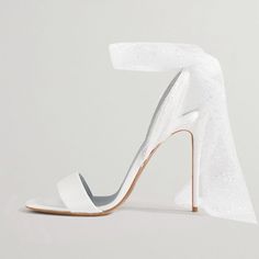 These elegant open-toe sandals are the ideal wedding shoe, bringing a touch of grace and refinement to your special day. Crafted from luxurious satin for a soft sheen, they feature a stiletto heel that elongates your silhouette with style. The open-toe design gives your feet some breathing room, while offering a chic peek of your pedicure. The shoes' secure strap ensures a comfortable fit, allowing you to enjoy your event carefree. Perfect for brides or simply for those desiring a touch of elega Wedding Heels With Heel Strap In Satin, Satin Heels With Heel Strap For Wedding, Elegant Open Toe Satin Wedding Shoes, Satin Open Heel Wedding Sandals, Wedding Satin Sandals With Open Heel, High Heel Satin Sandals For Wedding, Satin Wedding Heels With Padded Heel, Satin Heels With Padded Heel For Wedding, Satin Open Heel Sandals For Wedding