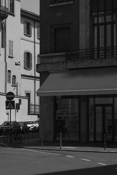 a black and white photo of an empty street